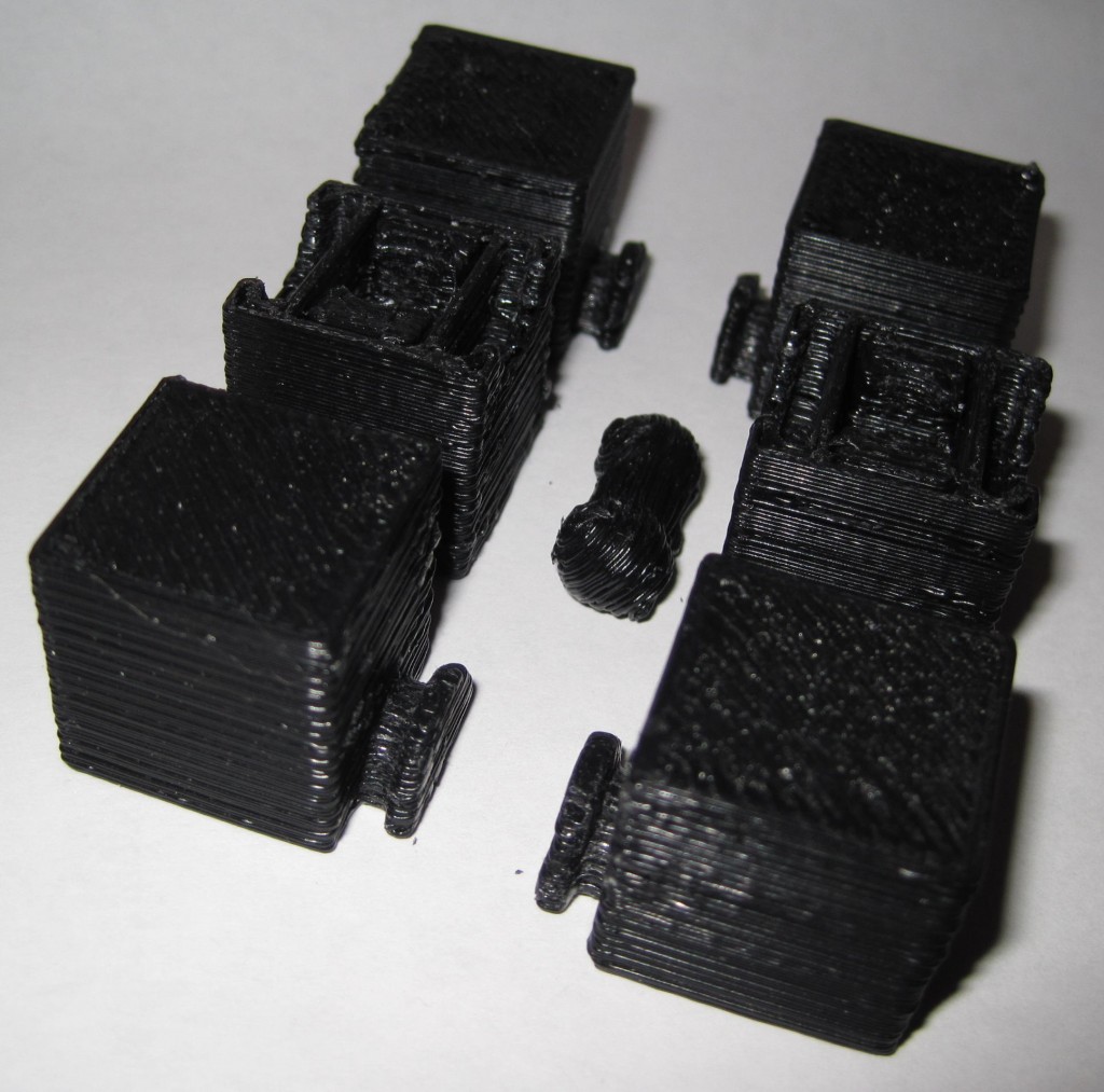 All seven parts of the 3x2x1 Rubik's cube puzzle, as they came off the MakerBot build platform