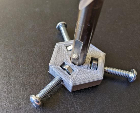 Drill bit inserted, machine screws tightened