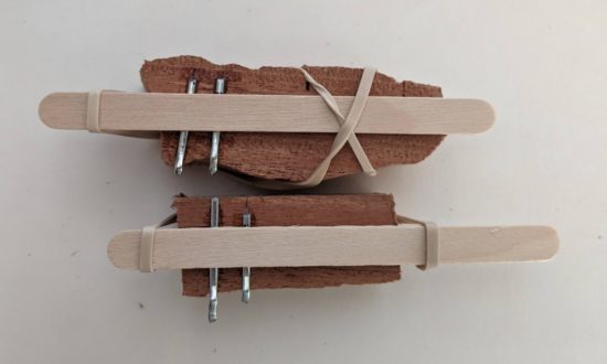 Glue, cotter pins, popsicle sticks and rubber bands