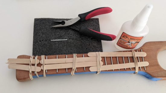 Frets glued and held down