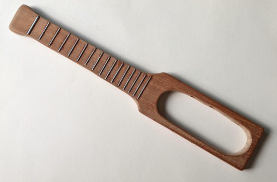 Sanded after the frets were glued in place